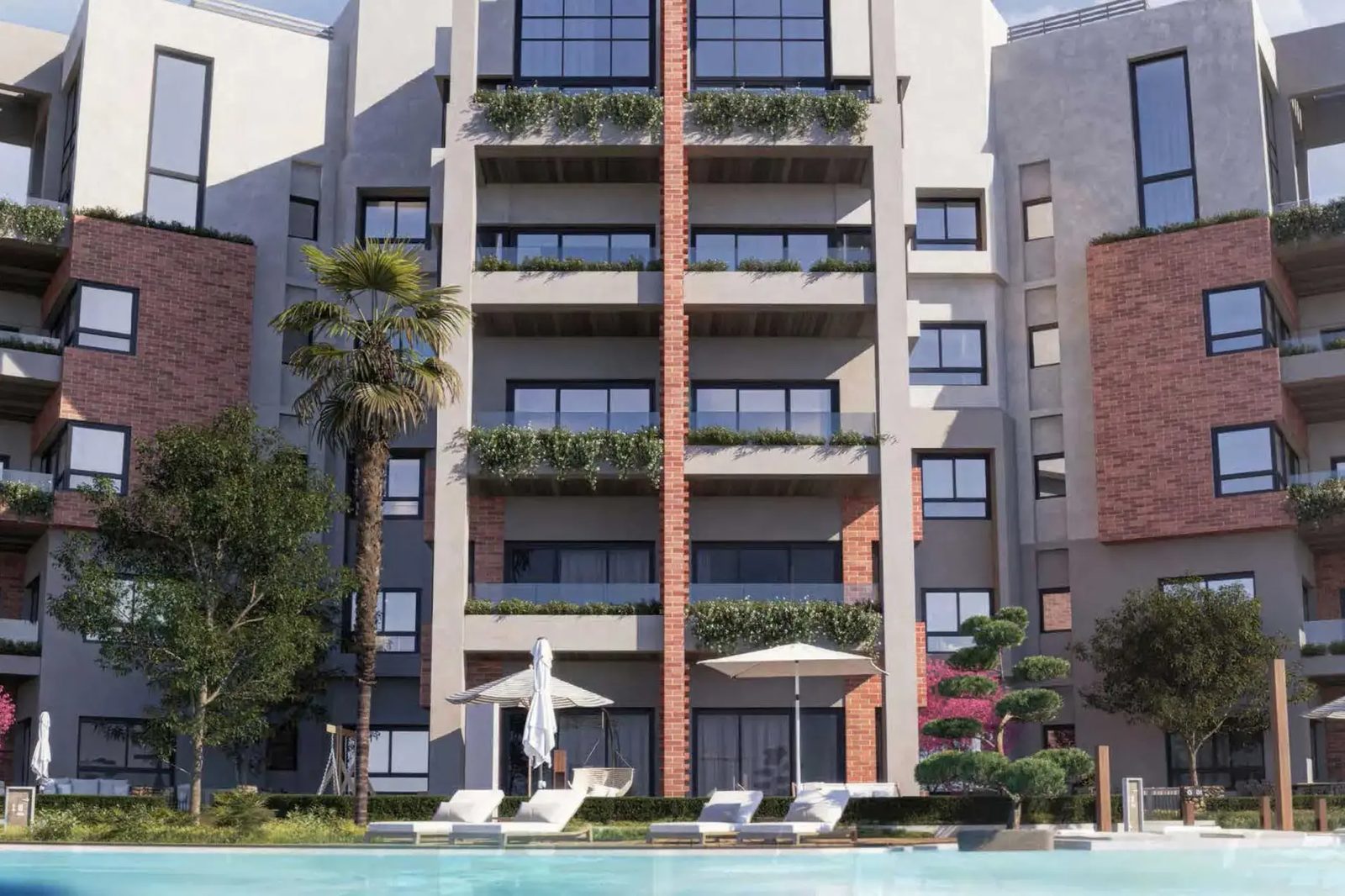 Zen Residences Muscat Bay — building facade above the pool