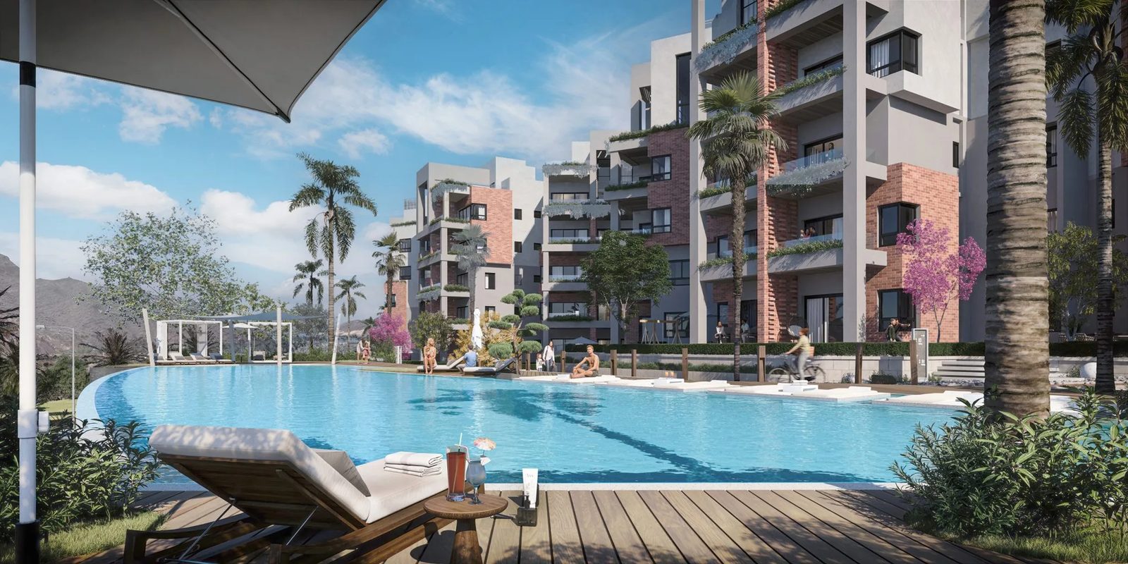 Zen Residences Muscat Bay — pool deck with sun loungers